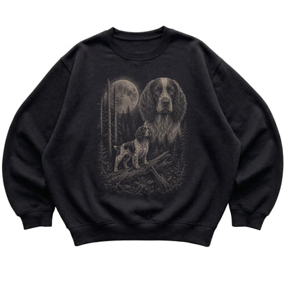 Springer Spaniel Moonlit Forest graphic on a black crewneck sweatshirt laid flat