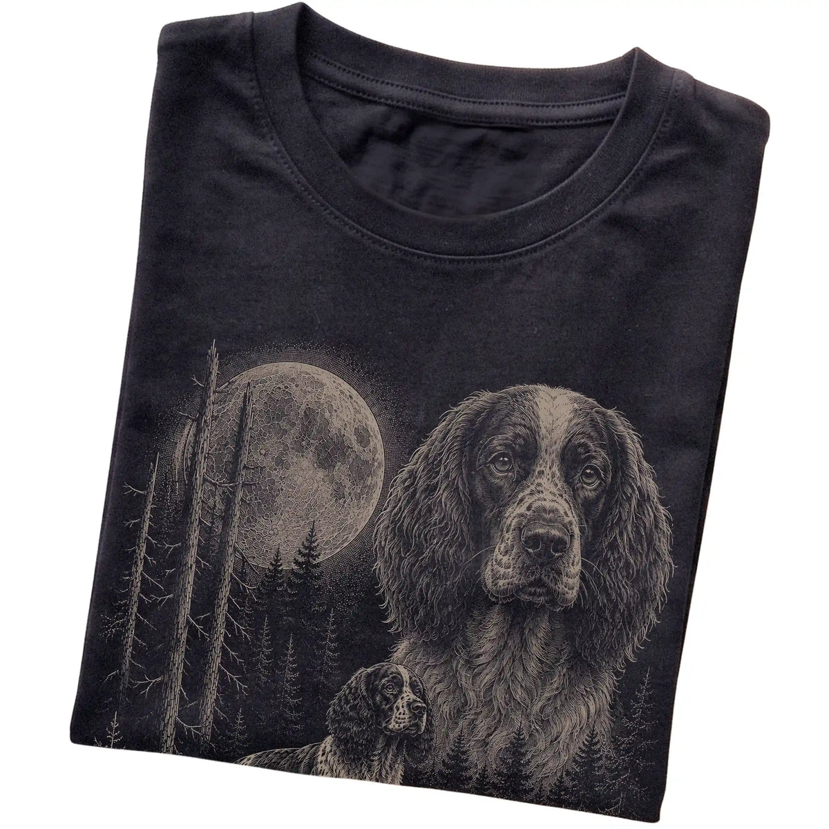 Folded black Softstyle T-shirt showing the Springer Spaniel Moonlit Forest graphic