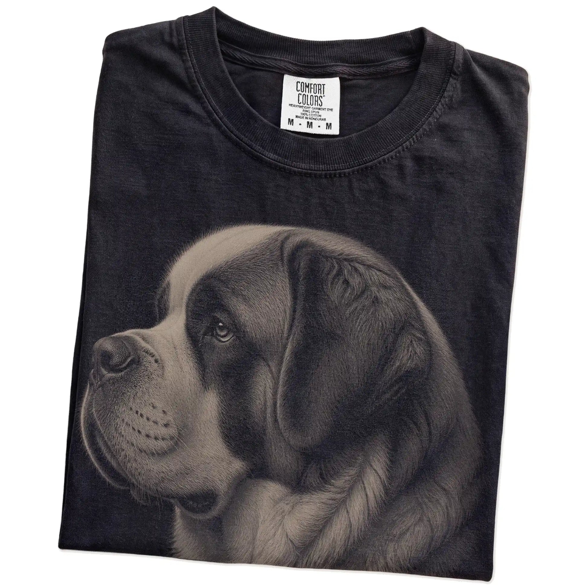 Folded Black Comfort Colors® T-shirt showing a detailed photographic portrait of a St Bernard