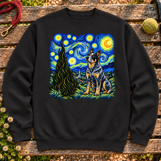 Colorful Blue Heeler beneath a swirling starry night sky on a Black sweatshirt