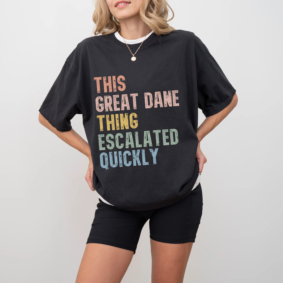 Model wearing a Black Comfort Colors® T-shirt with retro “This Great Dane Thing Escalated Quickly” lettering