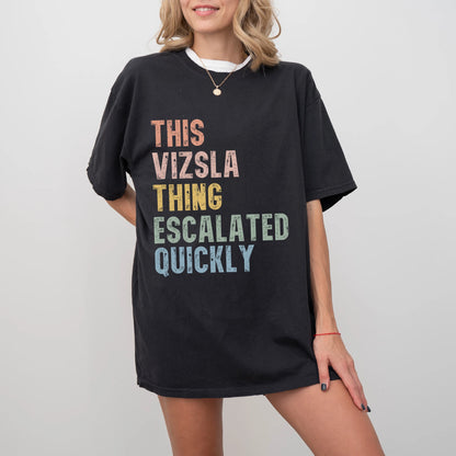 Model wearing a Black Comfort Colors® T-shirt with retro “This Vizsla Thing Escalated Quickly” lettering