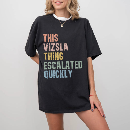 Model wearing a Black Comfort Colors® T-shirt with retro “This Vizsla Thing Escalated Quickly” lettering