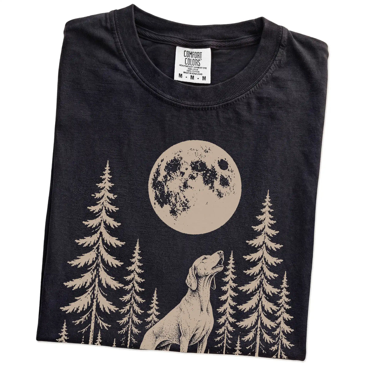 Folded Black Comfort Colors® T-shirt showing a Vizsla howling beneath the moon and pine trees