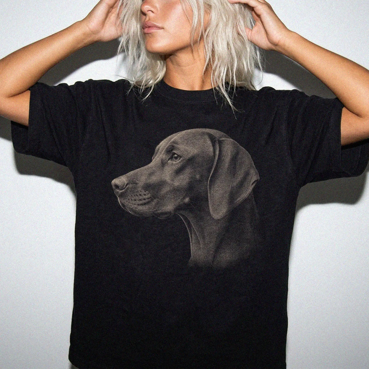 Model wearing a Black Comfort Colors® T-shirt with a detailed photographic portrait of a Vizsla