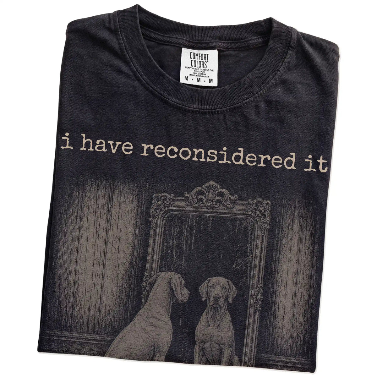 Folded Black Comfort Colors® T-shirt showing “the answer is still no” weimaraner design