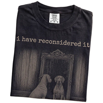 Folded Black Comfort Colors® T-shirt showing “the answer is still no” weimaraner design