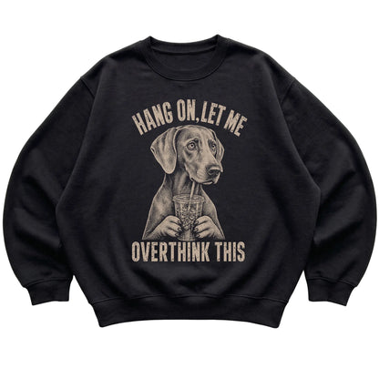 Black crewneck sweatshirt featuring Overthinking Weimaraner, laid-flat presentation