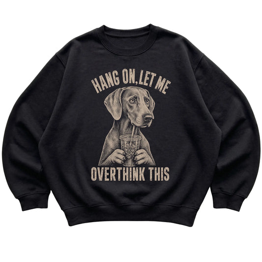 Black crewneck sweatshirt featuring Overthinking Weimaraner, laid-flat presentation