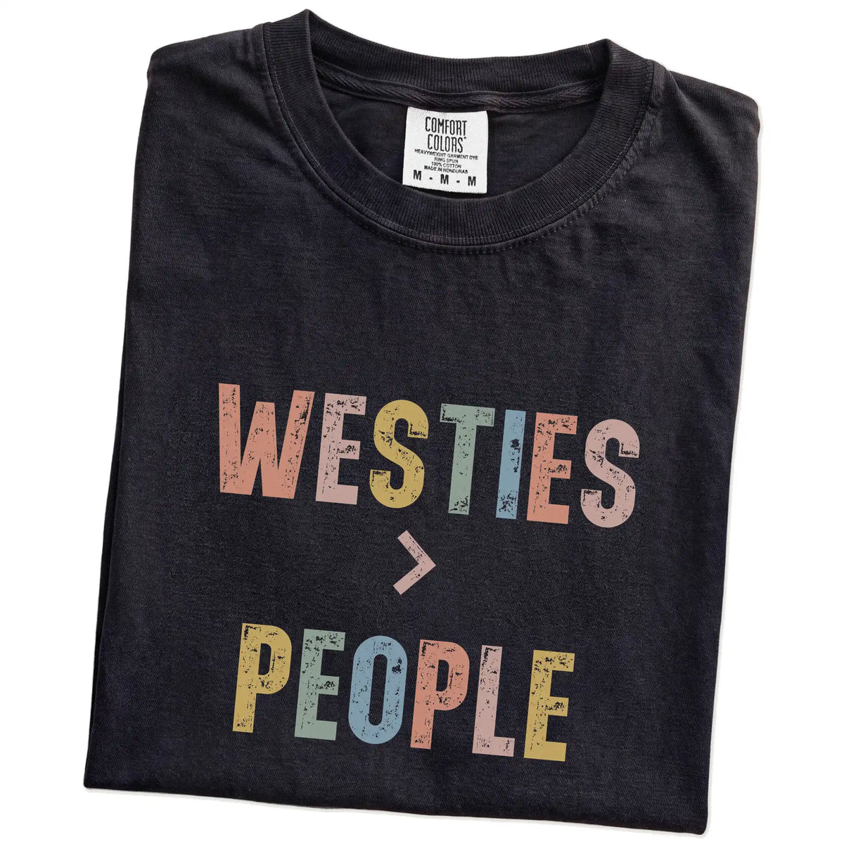 Folded Black Comfort Colors® T-shirt showing “Westies > People” text