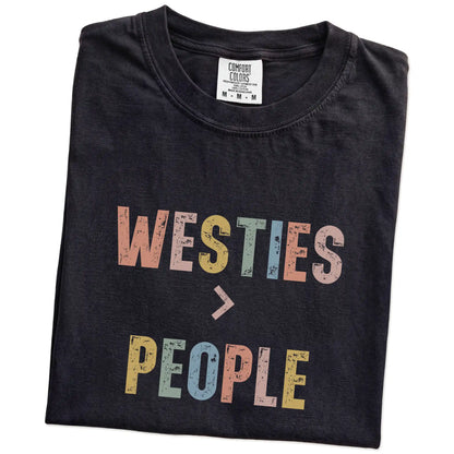 Folded Black Comfort Colors® T-shirt showing “Westies > People” text