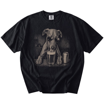 Whippet sneaking a drink from a foamy pint at home on a Black Comfort Colors® t-shirt