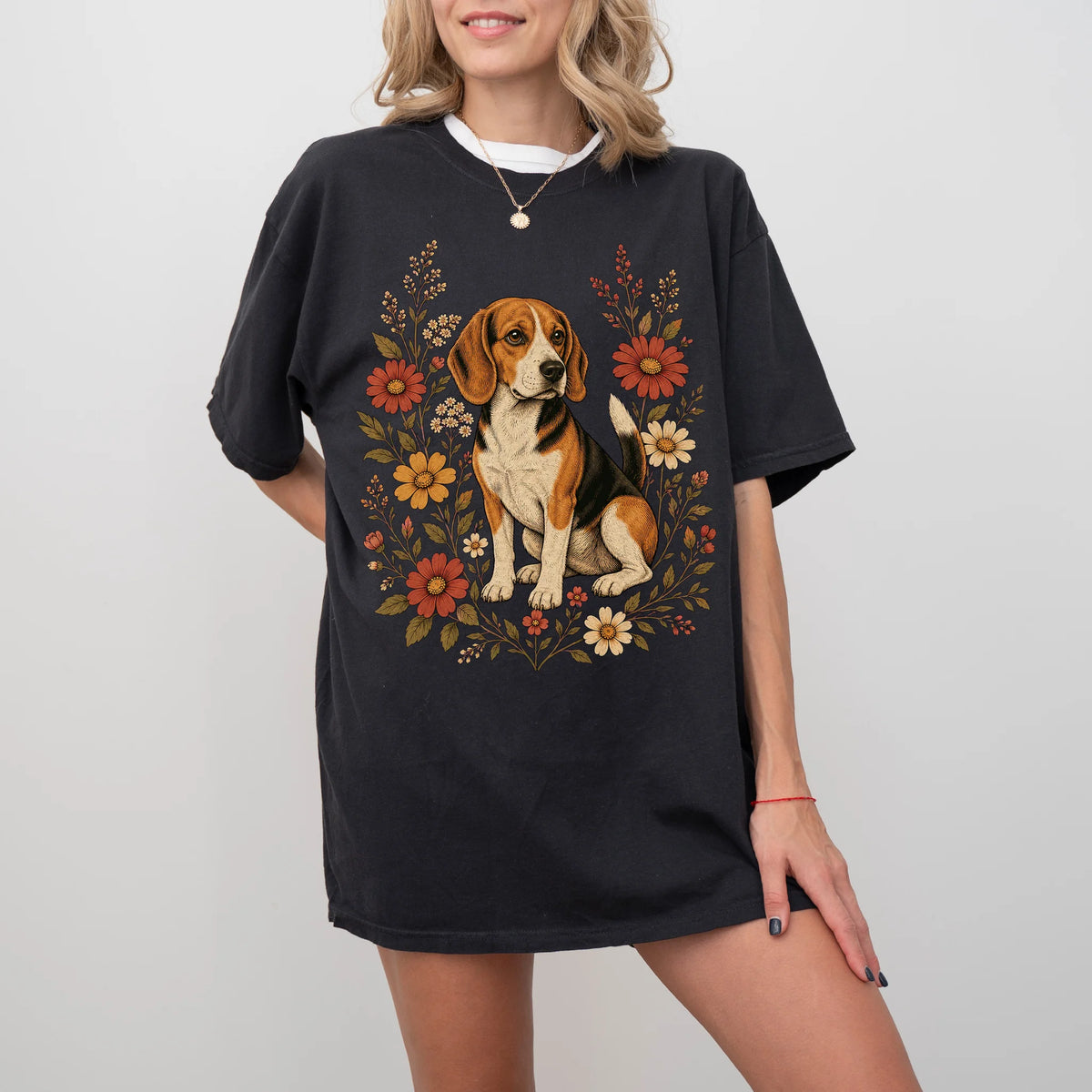 Model wearing a Black Comfort Colors® T-shirt showing Beagle portrait surrounded by wildflowers beneath the moon