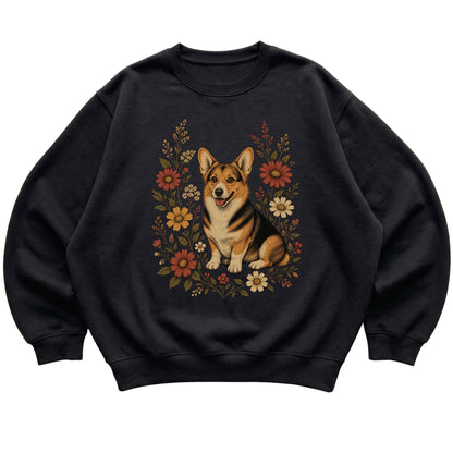 Black crewneck sweatshirt with Corgi portrait and wildflowers, flat lay