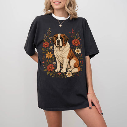 Model wearing a Black Comfort Colors® T-shirt showing Saint Bernard portrait surrounded by wildflowers beneath the moon
