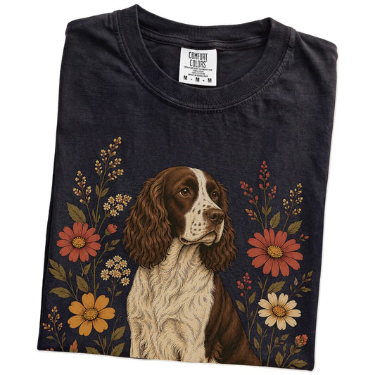 Folded Black Comfort Colors® T-shirt showing Springer Spaniel portrait surrounded by wildflowers beneath the moon