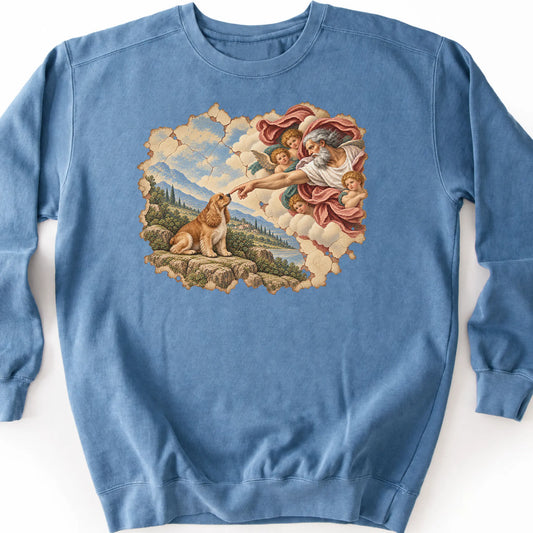 Cocker Spaniel Creation of Adam design on a blue jean sweatshirt
