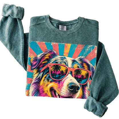 Folded Blue Spruce Comfort Colors sweatshirt with a Retro Australian Shepherd Mama design