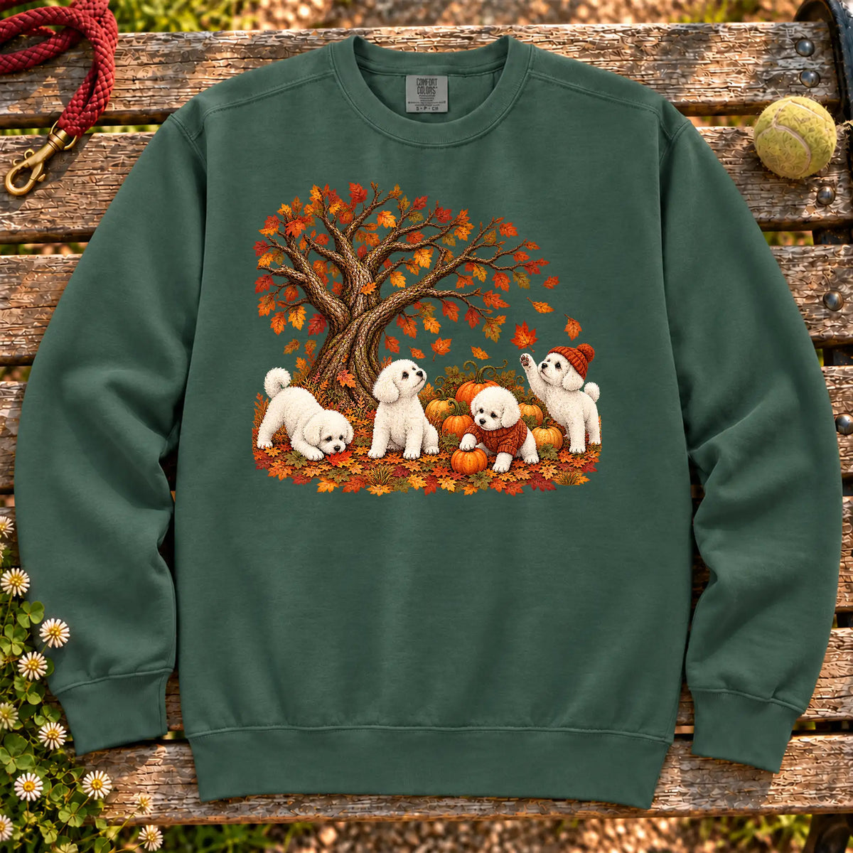 Four Bichon Frise puppies with pumpkins beneath an autumn tree on a Blue Spruce garment-dyed sweatshirt