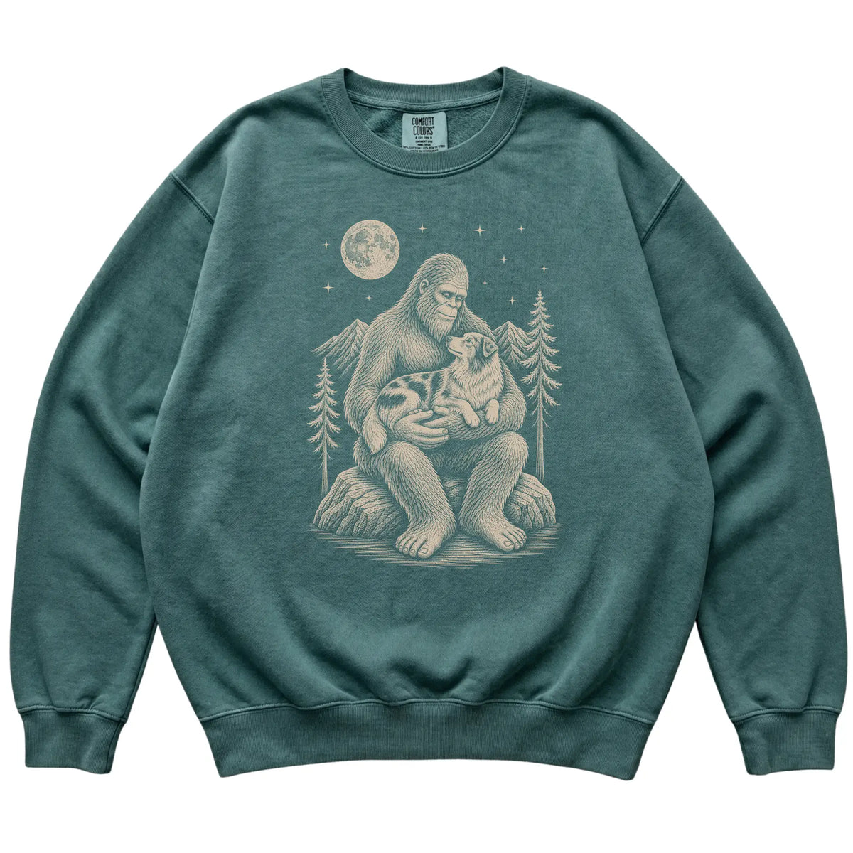 Blue Spruce sweatshirt with Bigfoot holding an Australian Shepherd under a moonlit sky