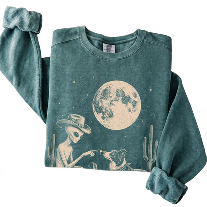 Blue Spruce Comfort Colors® sweatshirt featuring Border Collie Cowboy and Alien, folded presentation