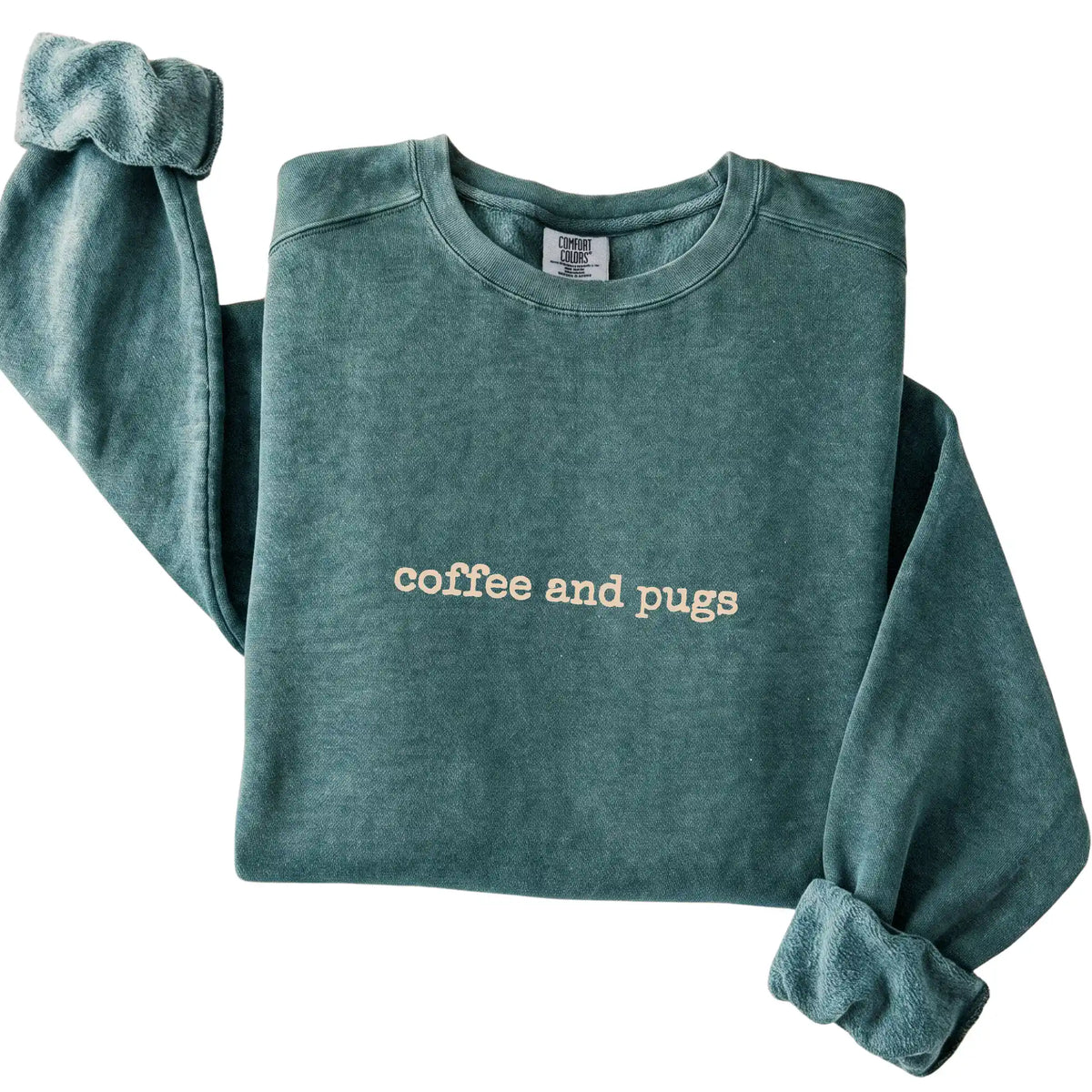 Blue Spruce Coffee and Pugs Comfort Colors sweatshirt folded to show the printed design