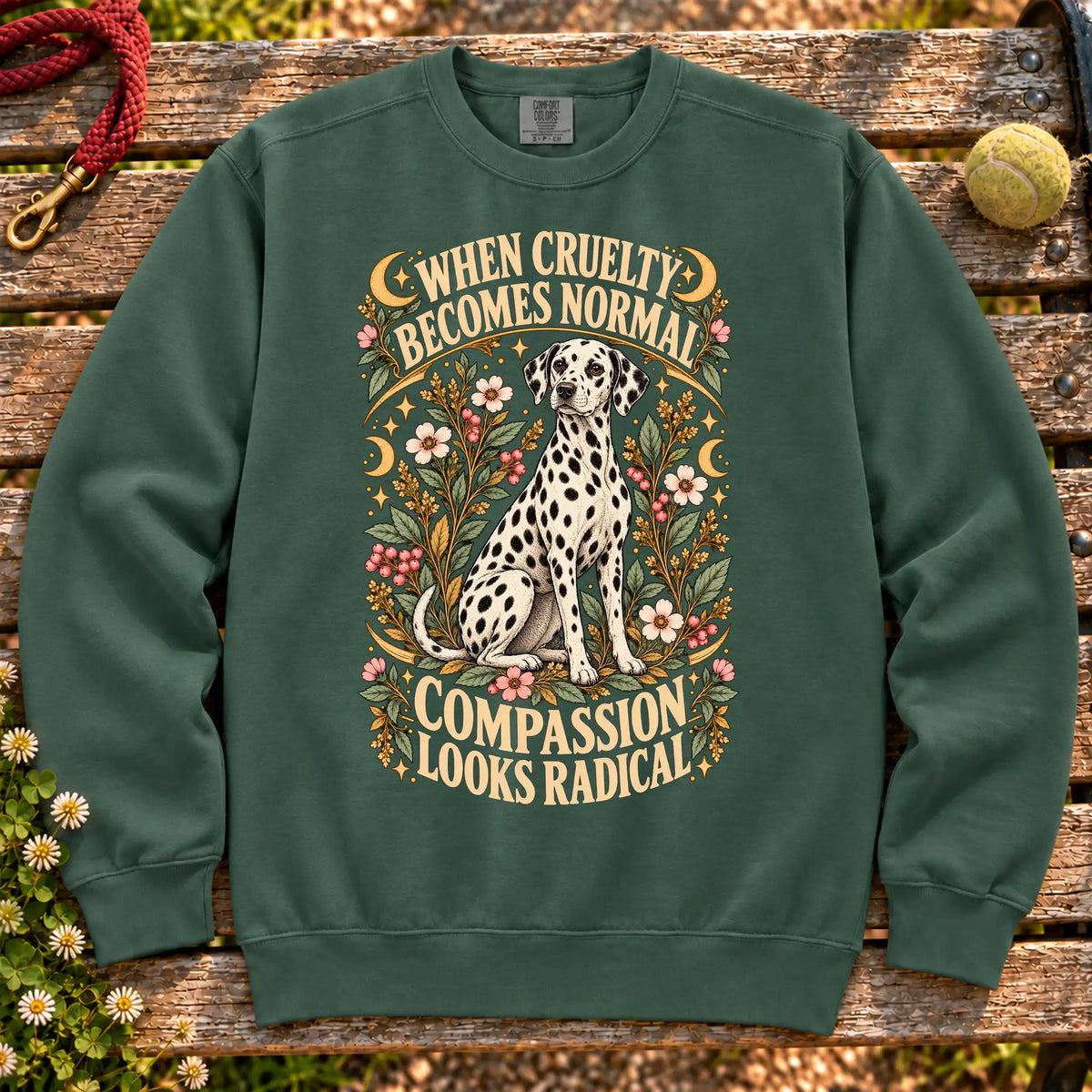Compassion Looks Radical Dalmatian design on a Blue Spruce Comfort Colors sweatshirt