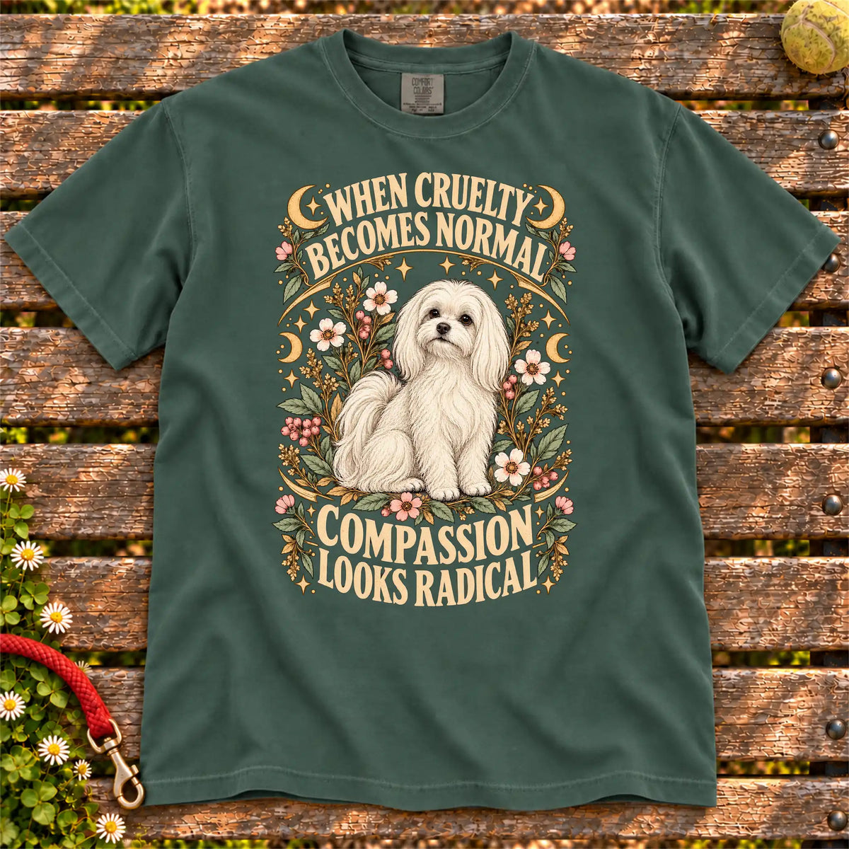 Compassion Looks Radical Maltese design on a Blue Spruce Comfort Colors T-shirt