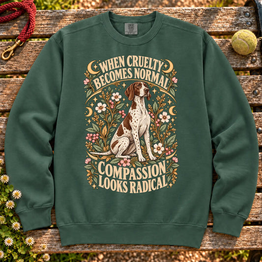 Compassion Looks Radical Pointer design on a Blue Spruce Comfort Colors sweatshirt