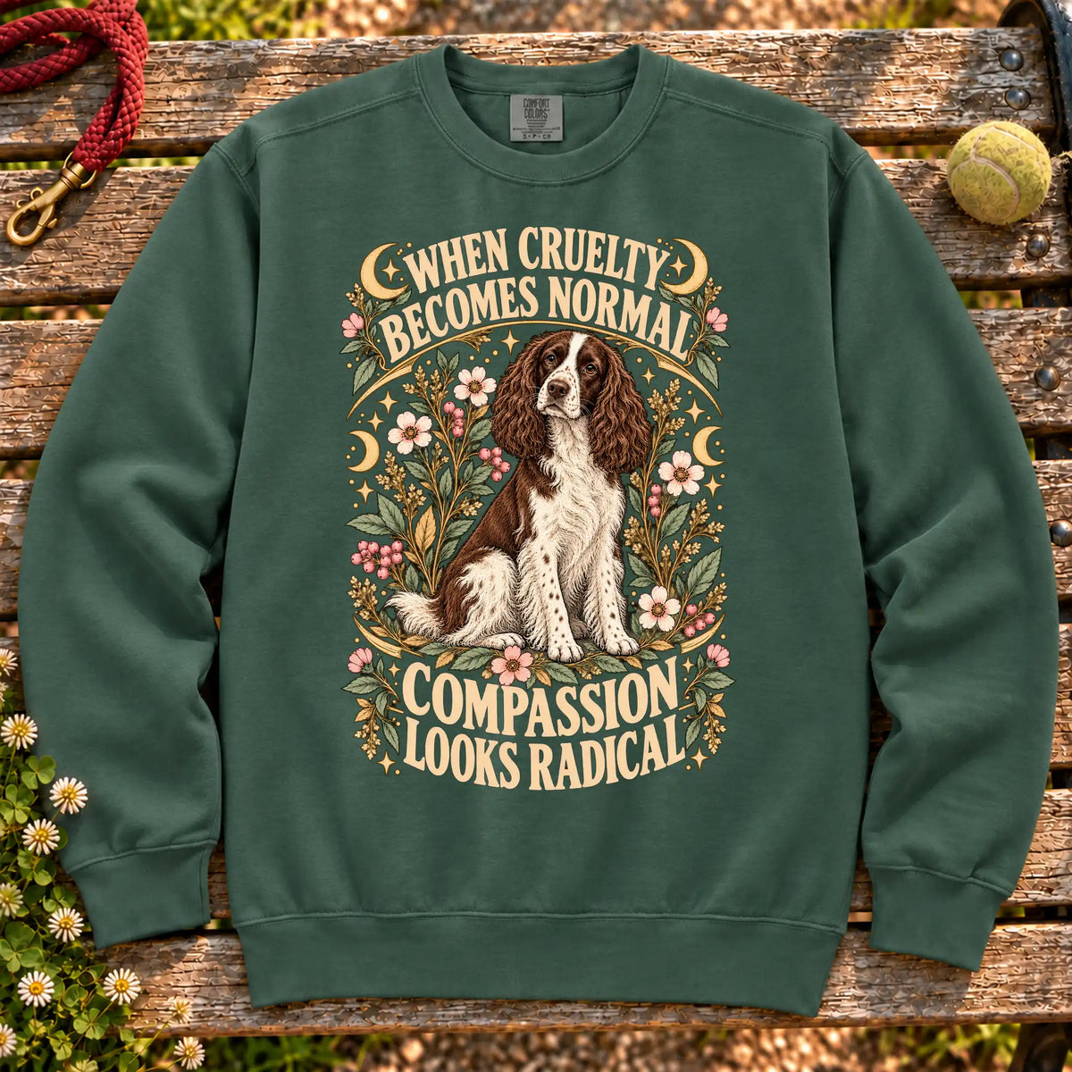 Compassion Looks Radical Springer Spaniel design on a Blue Spruce Comfort Colors sweatshirt