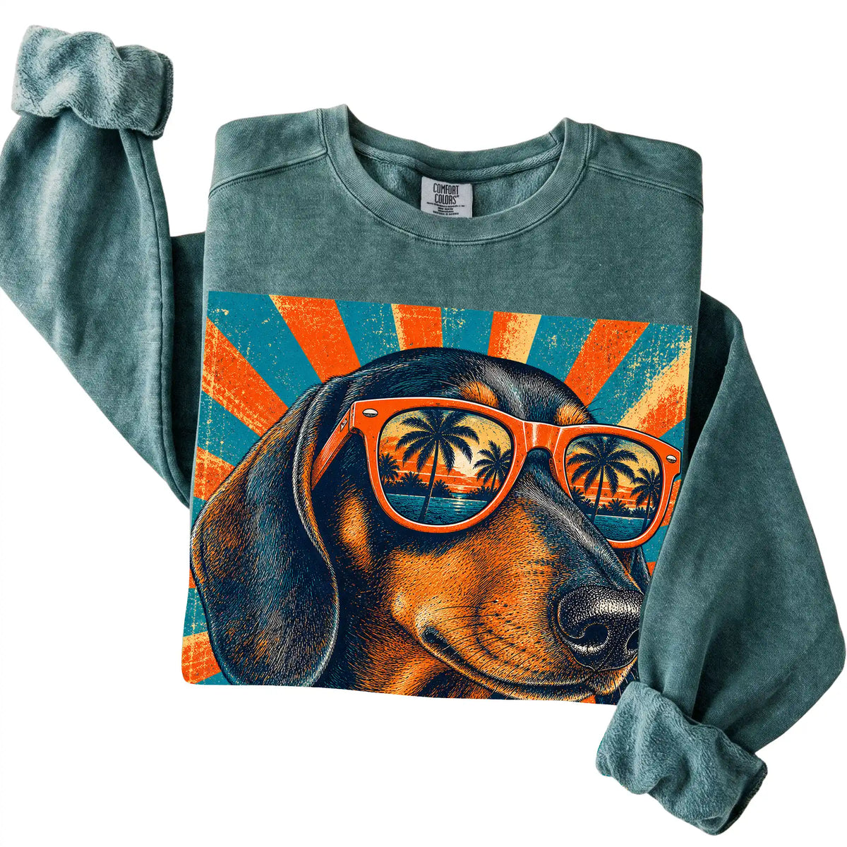 Folded Blue Spruce Comfort Colors sweatshirt with a Retro Dachshund Dad design