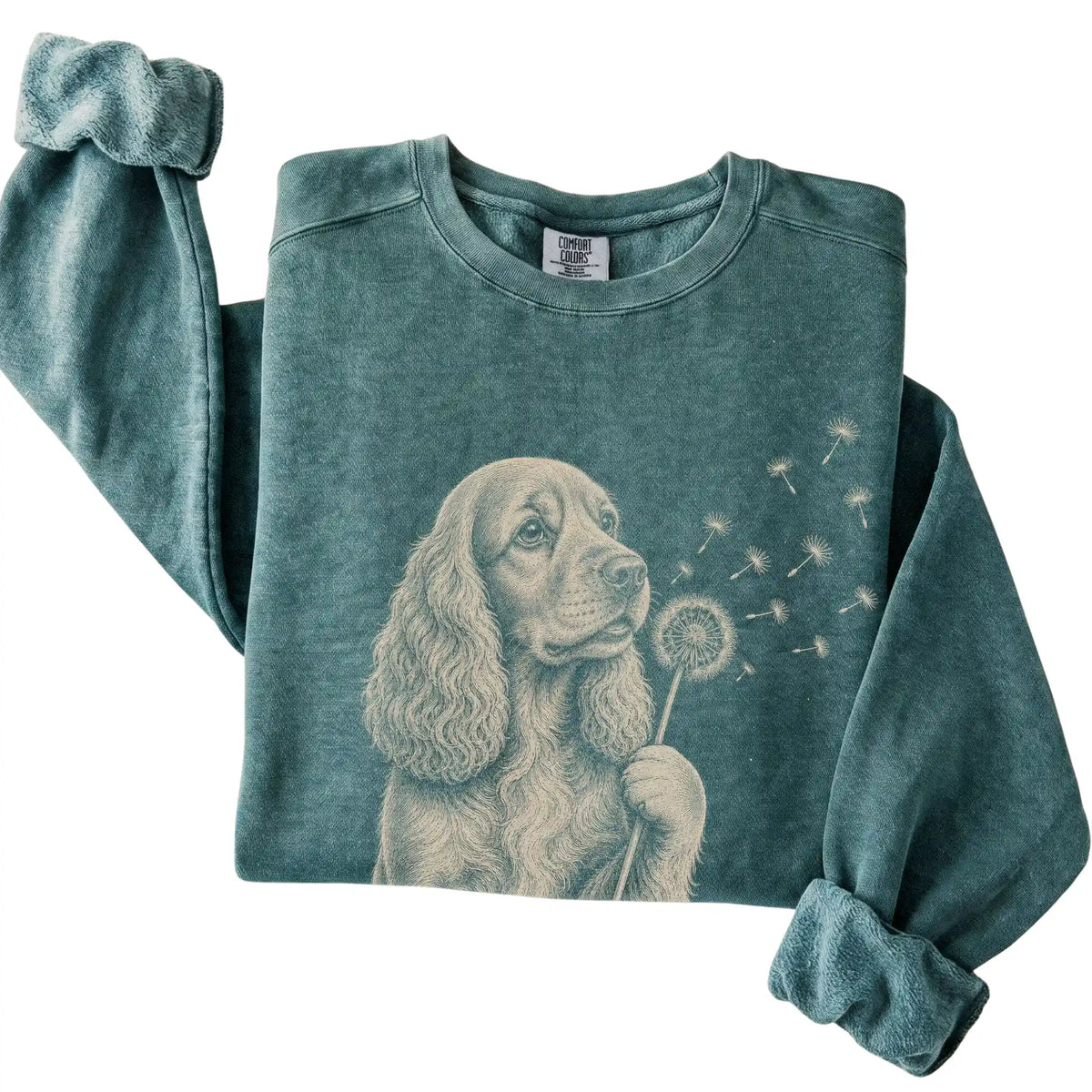 Blue Spruce Comfort Colors® sweatshirt featuring Dandelion Cocker Spaniel, folded presentation