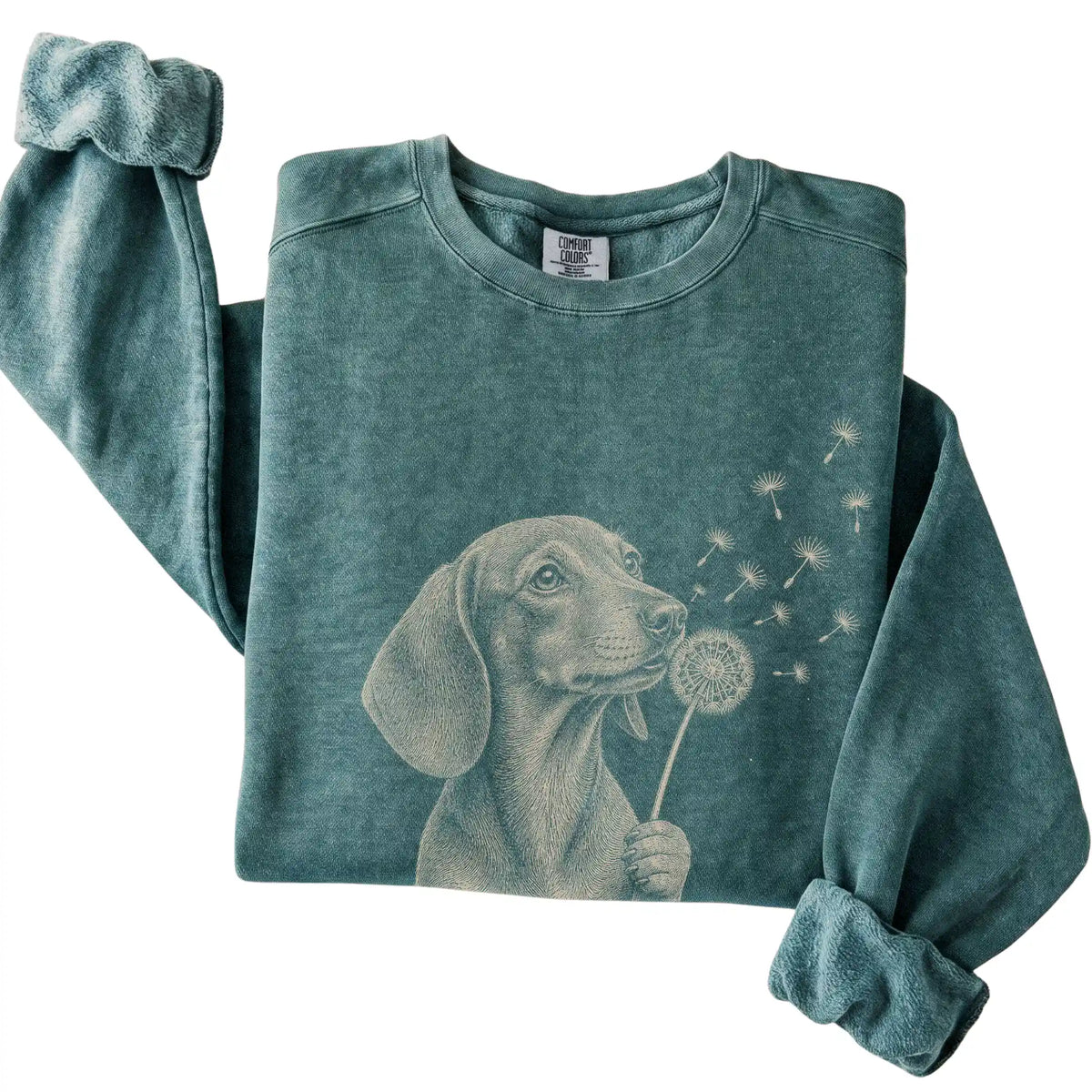 Blue Spruce Comfort Colors® sweatshirt featuring Dandelion Dachshund, folded presentation