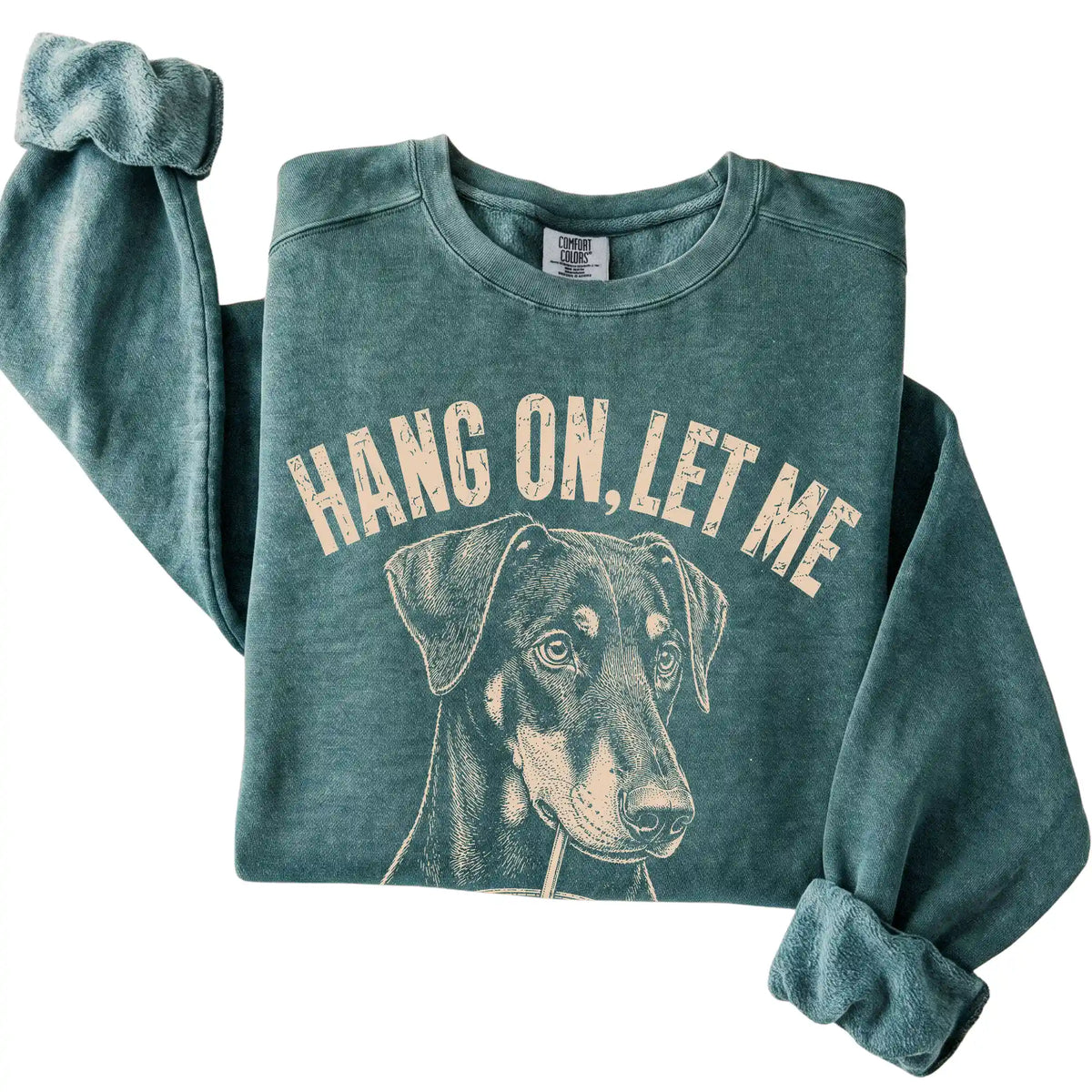 Blue Spruce Comfort Colors sweatshirt featuring Doberman Iced Coffee Overthink, folded presentation