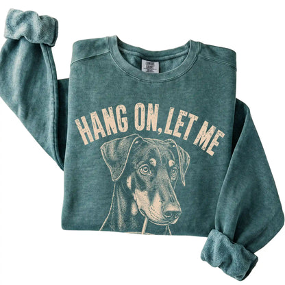Blue Spruce Comfort Colors sweatshirt featuring Doberman Iced Coffee Overthink, folded presentation