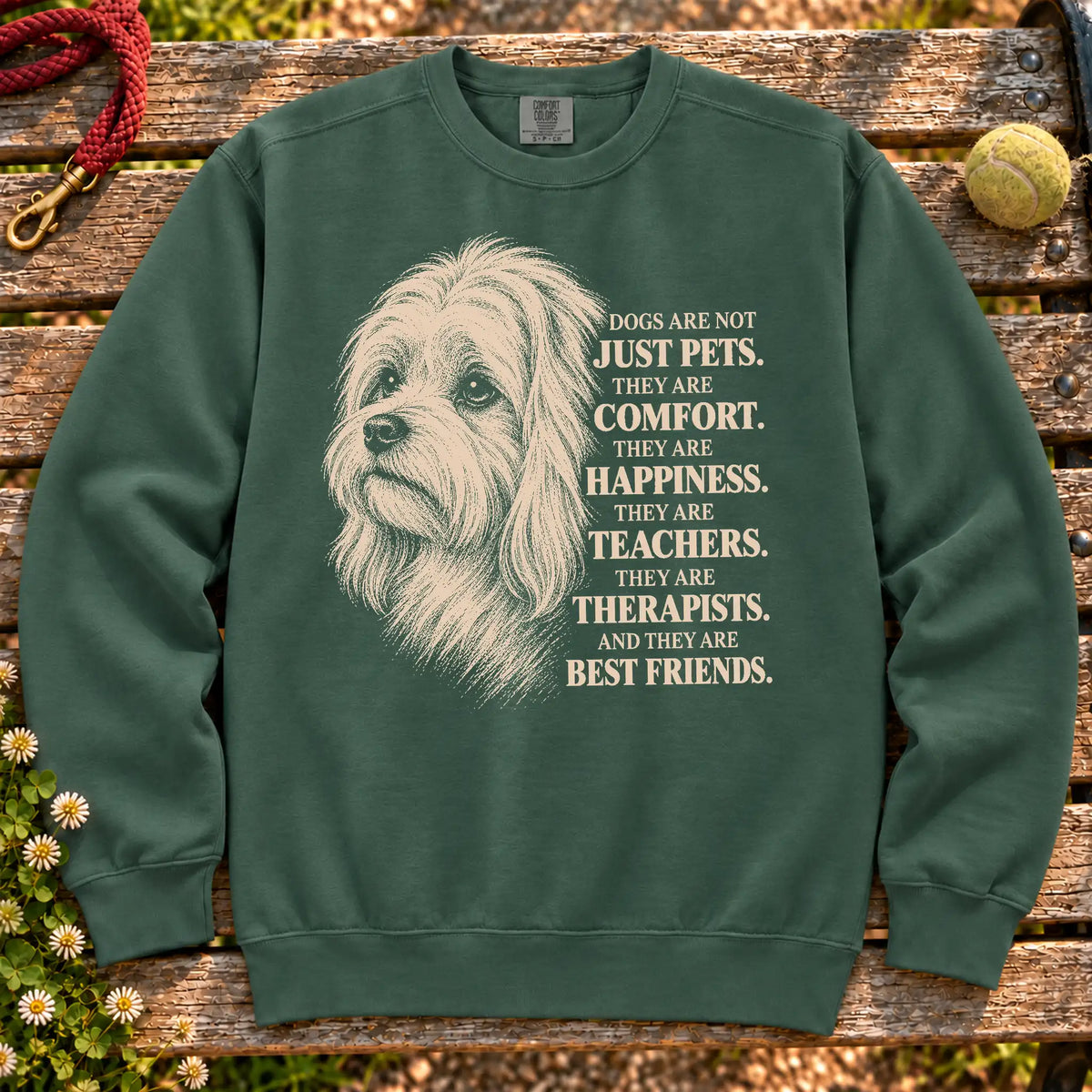 Dogs Are Not Just Pets Maltese text design on a Blue Spruce Comfort Colors sweatshirt