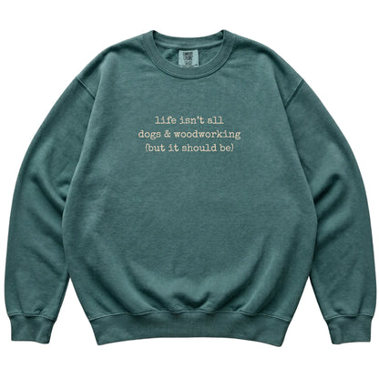 Blue Spruce Dogs and Woodworking Comfort Colors sweatshirt laid flat