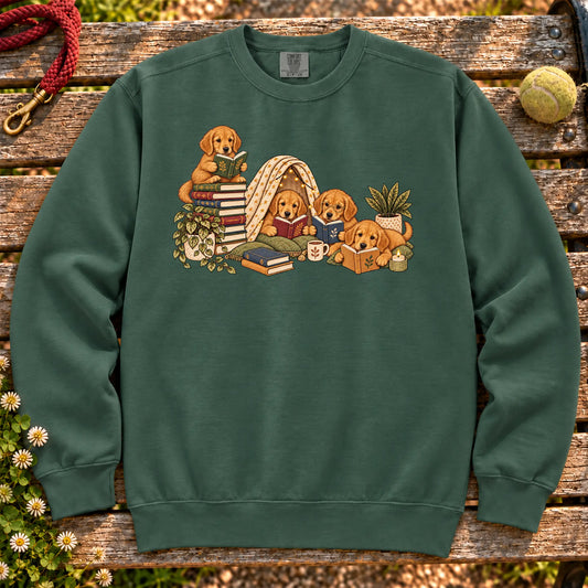 Golden Retriever puppies reading books in a cozy blanket fort on a Blue Spruce sweatshirt