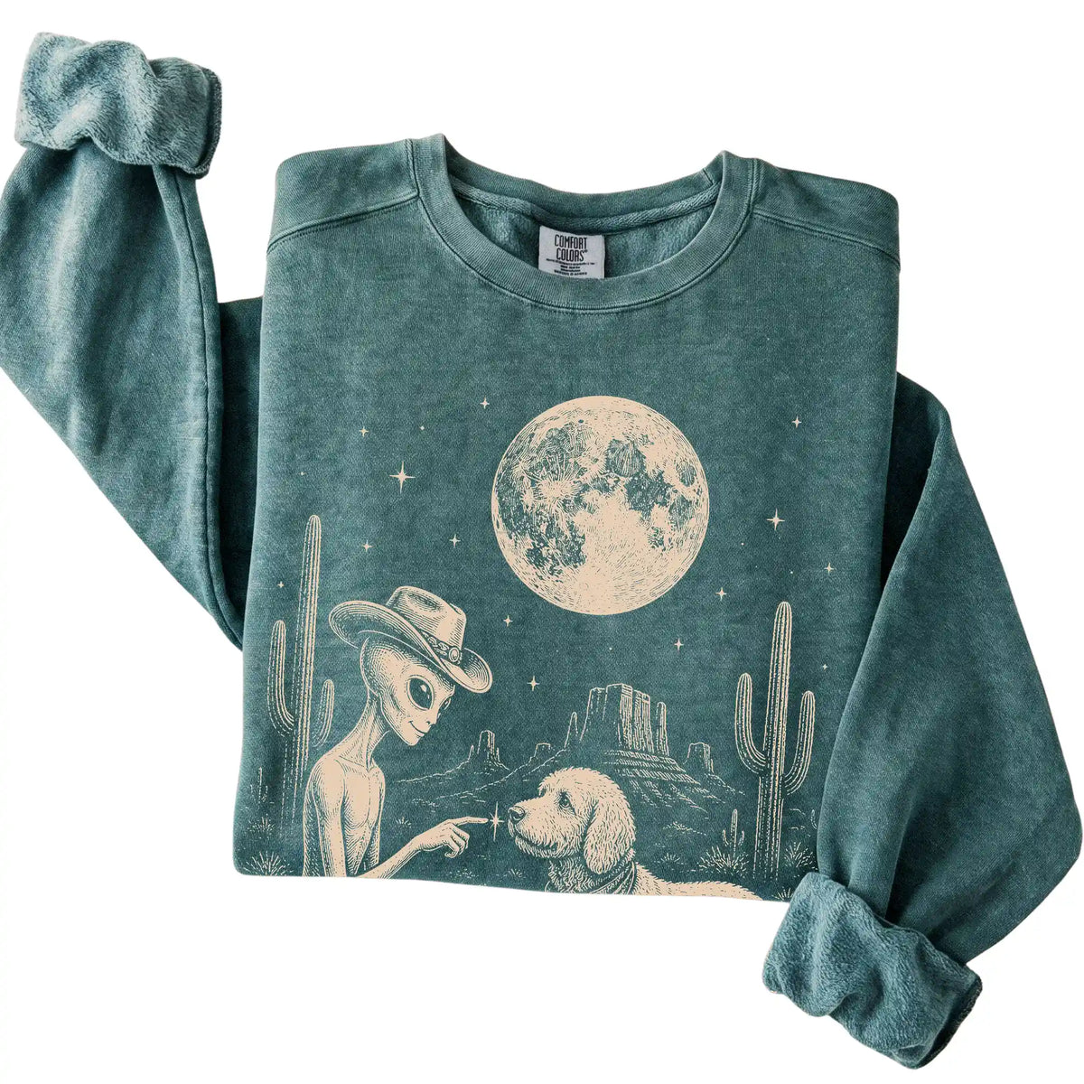 Blue Spruce Comfort Colors® sweatshirt featuring Goldendoodle Cowboy and Alien, folded presentation
