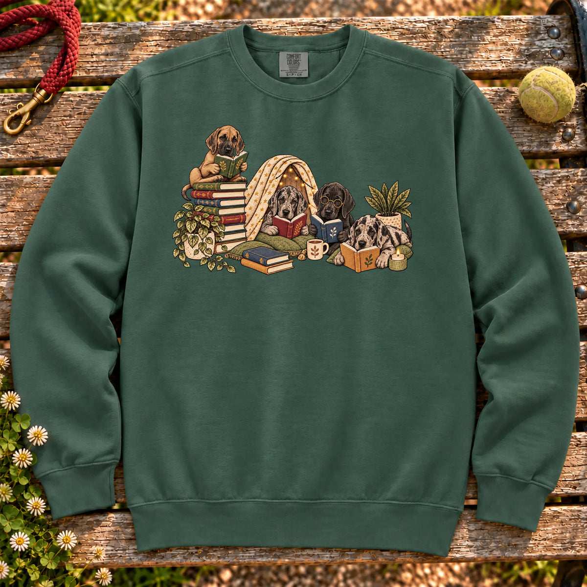 Great Dane puppies reading books in a cozy blanket fort on a Blue Spruce sweatshirt
