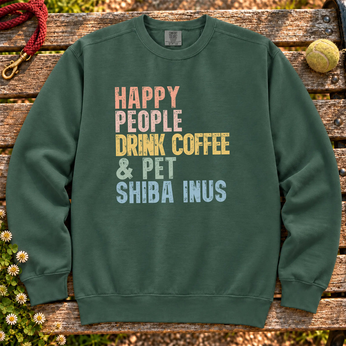 “Happy people drink coffee & pet Shiba Inus” text on a Blue Spruce sweatshirt