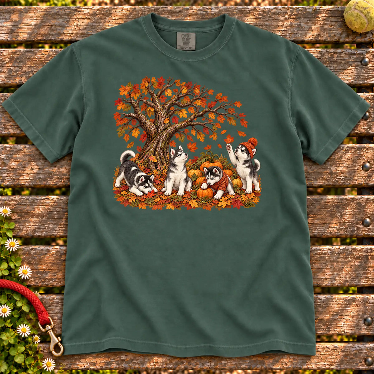Four Husky puppies with pumpkins beneath an autumn tree on a Blue Spruce garment-dyed T-shirt