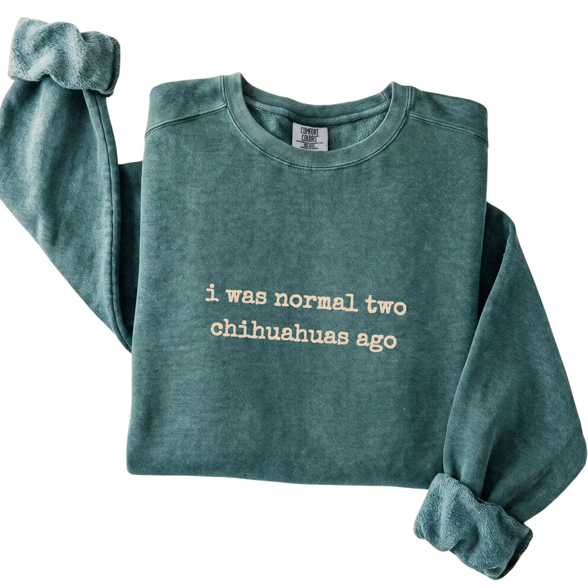 Blue Spruce I Was Normal Two Chihuahuas Ago Comfort Colors sweatshirt folded to show the printed design