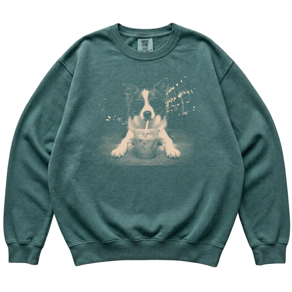 Border Collie wearing aviator sunglasses and drinking iced coffee on a Blue Spruce Comfort Colors 1566 Sweatshirt, flat lay view