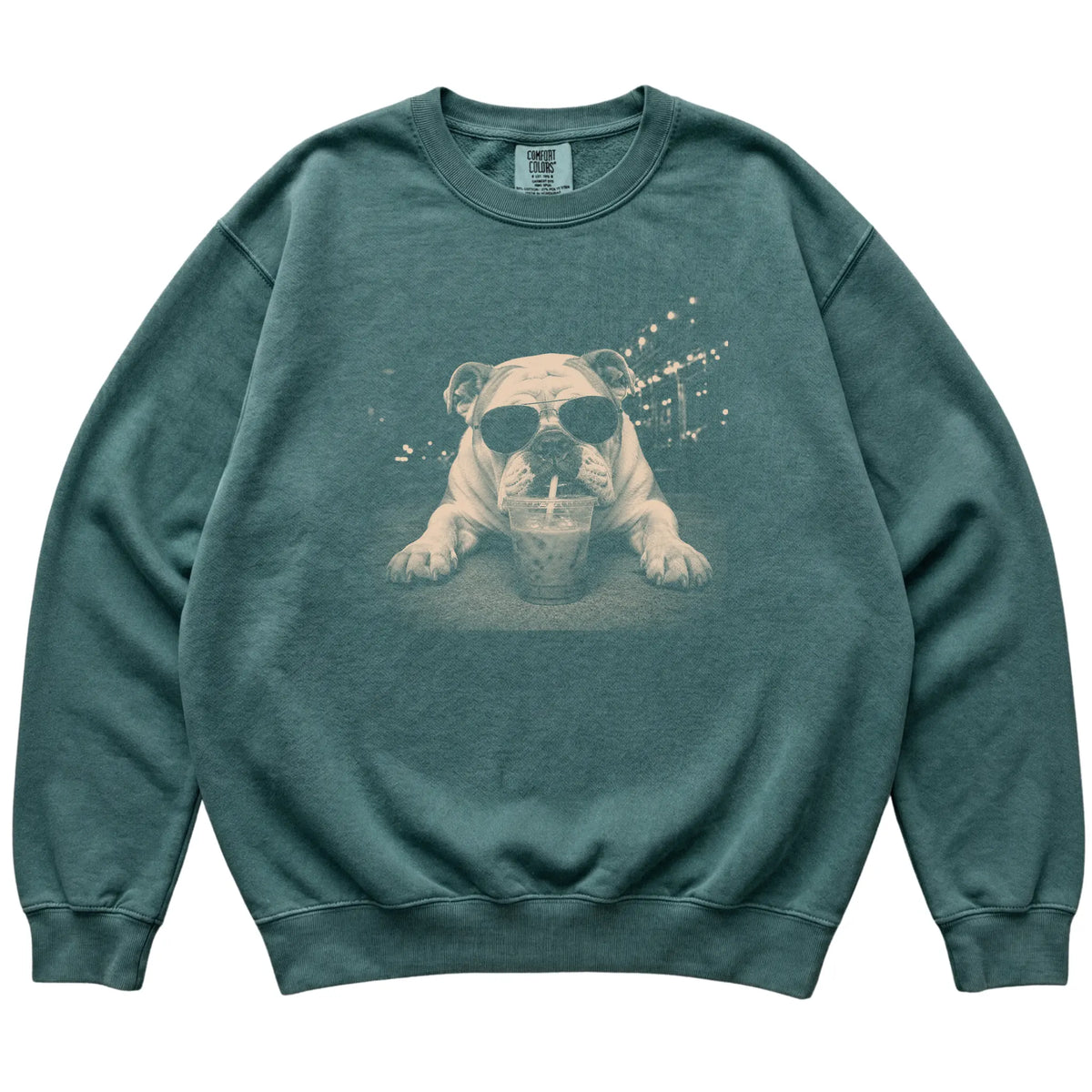 Bulldog wearing aviator sunglasses and drinking iced coffee on a Blue Spruce Comfort Colors 1566 Sweatshirt, flat lay view