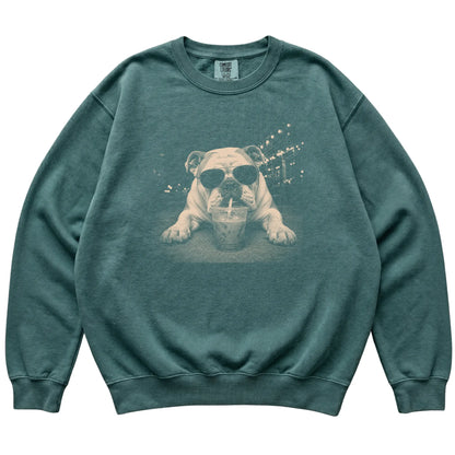 Bulldog wearing aviator sunglasses and drinking iced coffee on a Blue Spruce Comfort Colors 1566 Sweatshirt, flat lay view