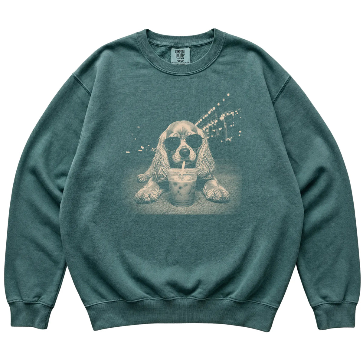 Cocker Spaniel wearing aviator sunglasses and drinking iced coffee on a Blue Spruce Comfort Colors 1566 Sweatshirt, flat lay view