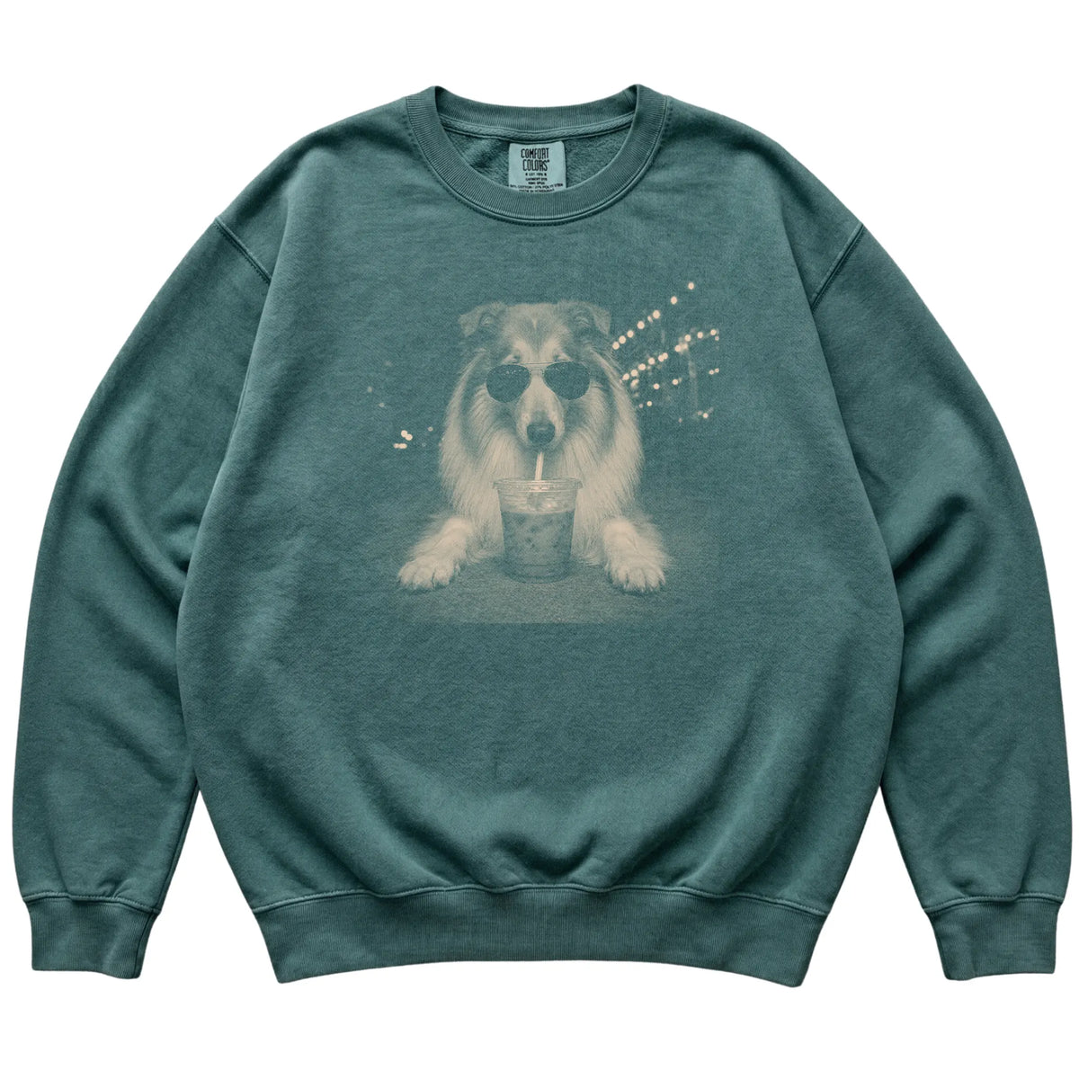 Collie wearing aviator sunglasses and drinking iced coffee on a Blue Spruce Comfort Colors 1566 Sweatshirt, flat lay view