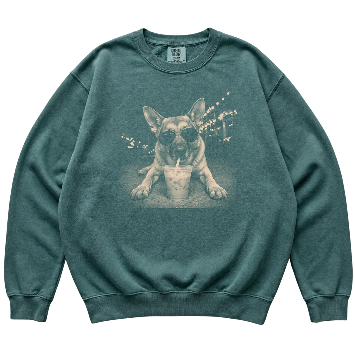 German Shepherd wearing aviator sunglasses and drinking iced coffee on a Blue Spruce Comfort Colors 1566 Sweatshirt, flat lay view