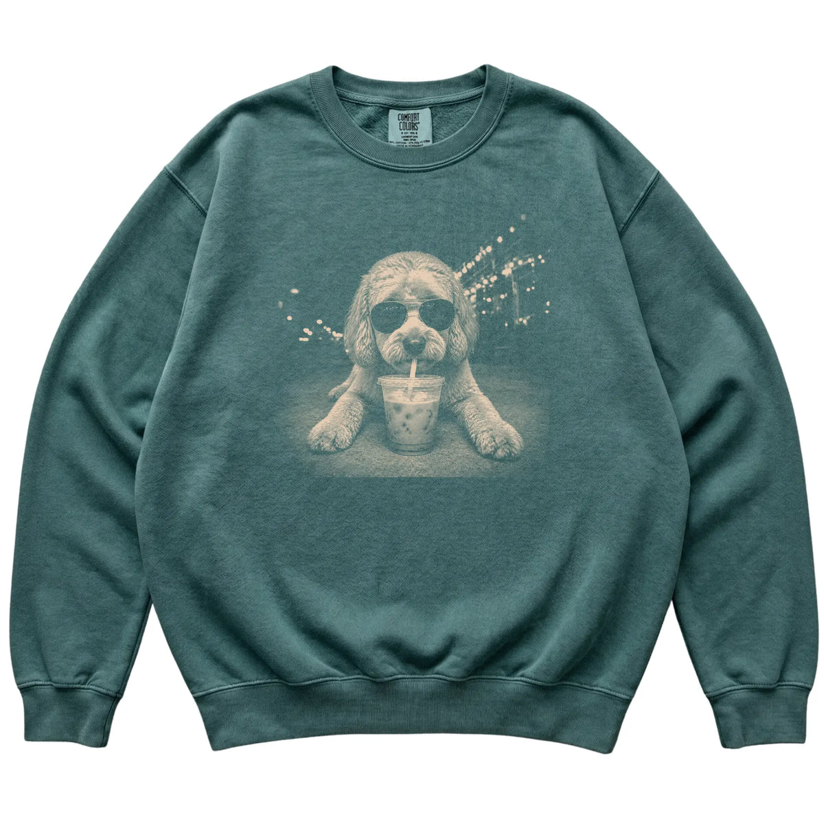 Labradoodle wearing aviator sunglasses and drinking iced coffee on a Blue Spruce Comfort Colors 1566 Sweatshirt, flat lay view